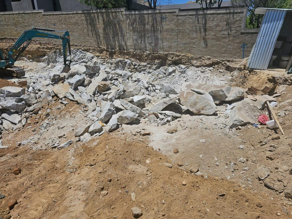 Rock breaking chemical being broken out with RBD hammer.