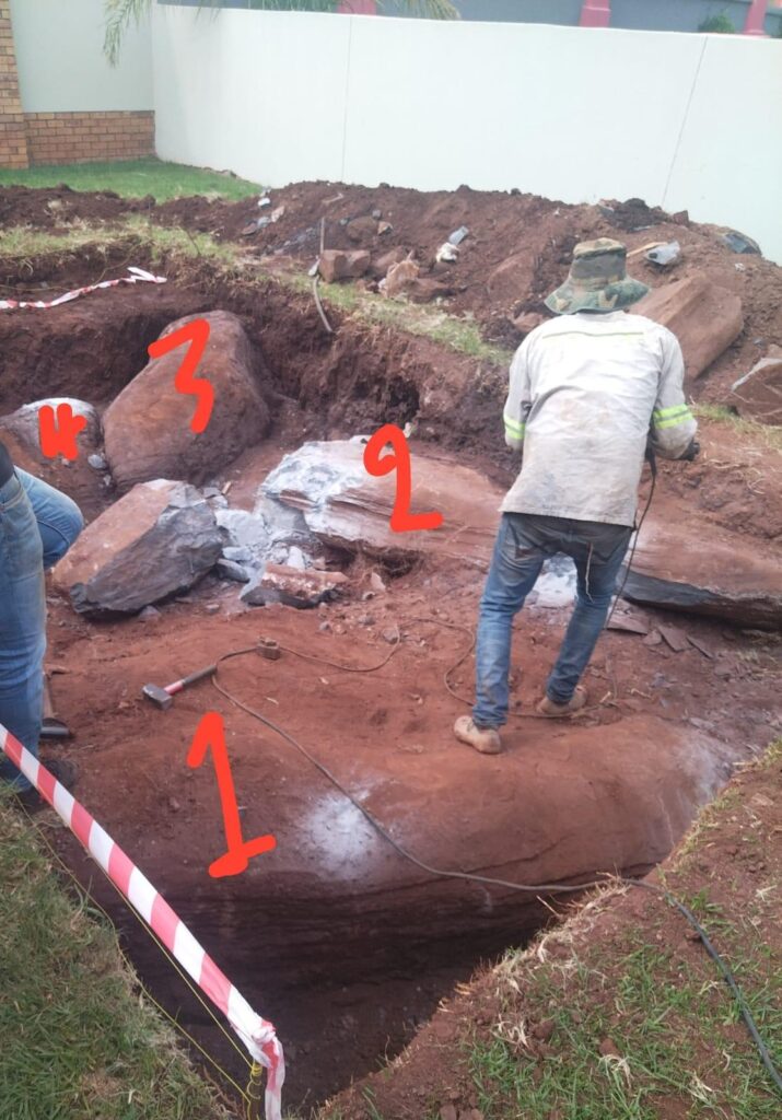 Rock Breaking of boulders and outcrop with Dadra rock splitter.